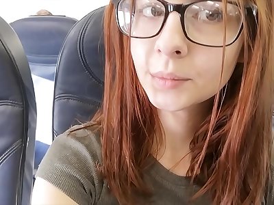 Cute adult movie star fingers herself in airplane bathroom